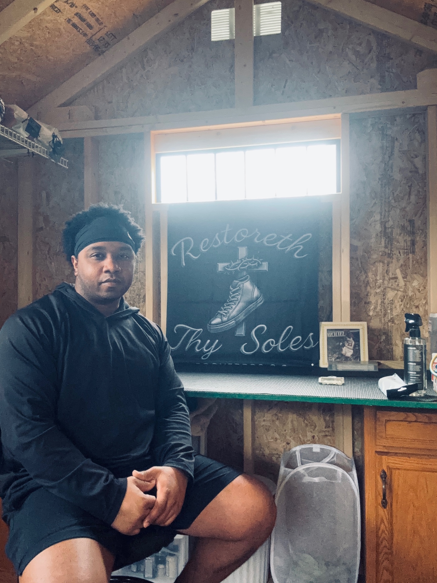 Jahlil Minter, founder of Restoreth Thy Soles, in his restoration studio